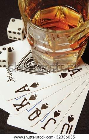 stock-photo-shot-glass-of-whiskey-on-playing-cards-32336035.jpg